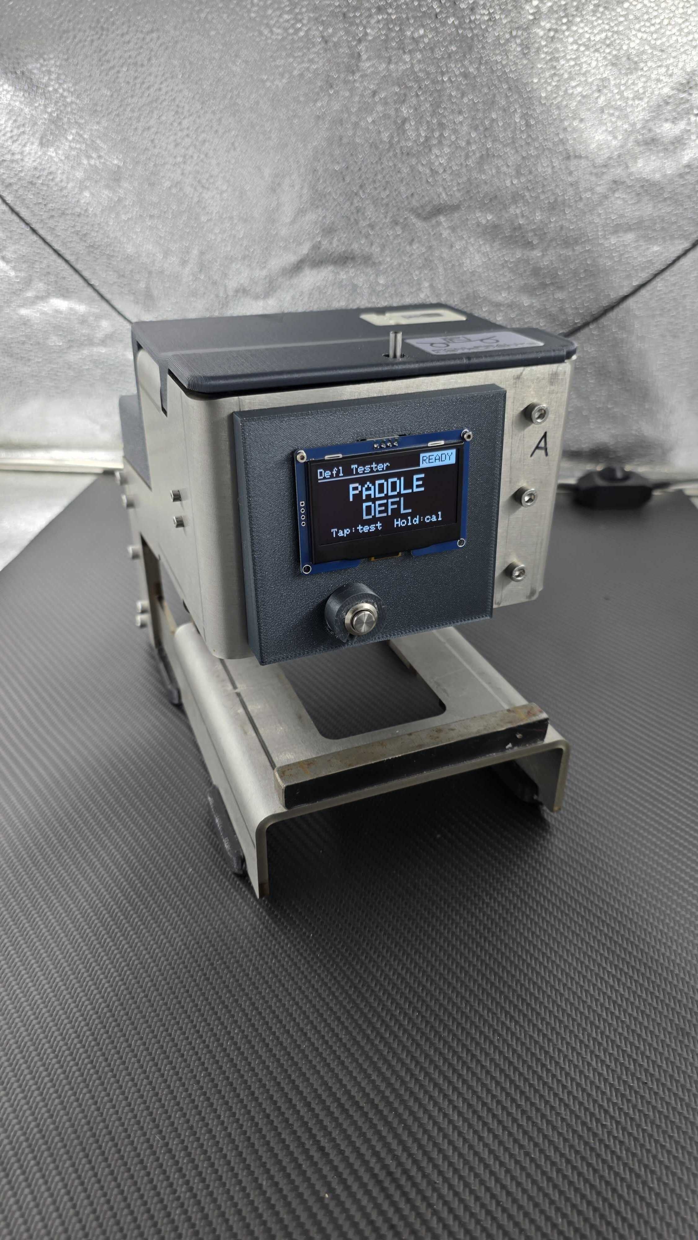 Deflection testing instrument with its control display illuminated