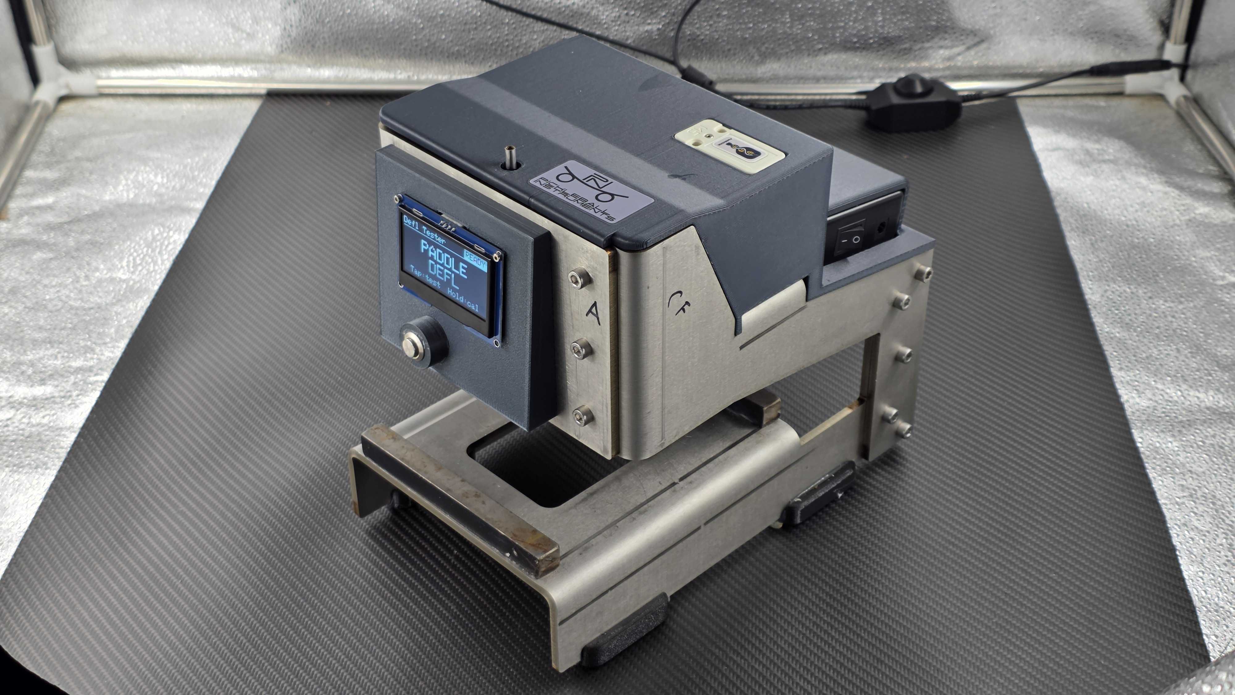 Pickleball paddle deflection testing instrument viewed from the front